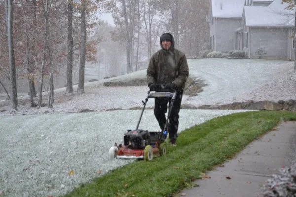 cutting lawns in snow