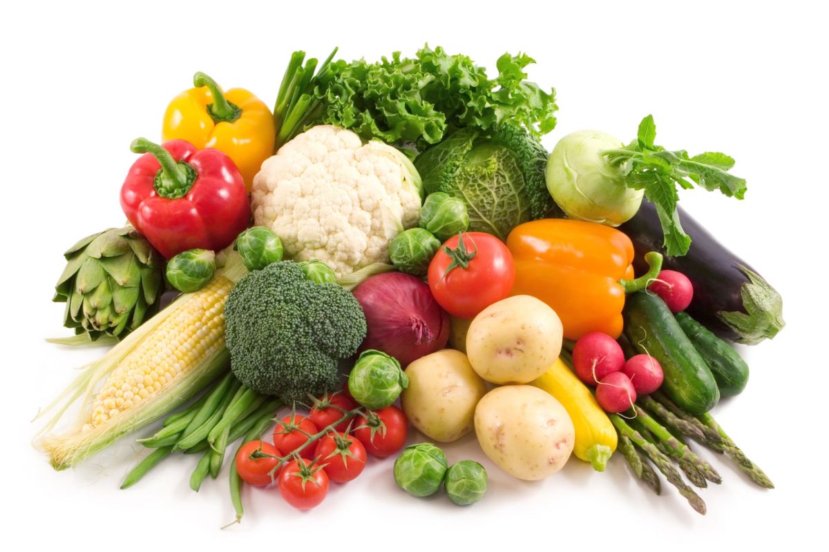 pile of fresh vegetables including potatoes, peppers, cauliflower and sweetcorn